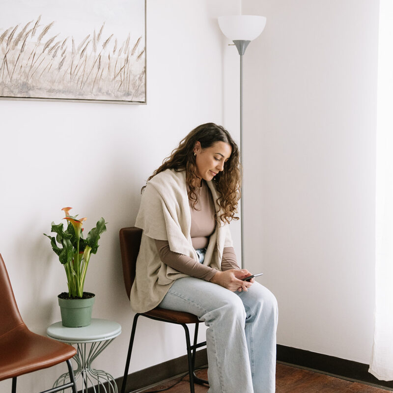 Woman journaling in a peaceful therapy space